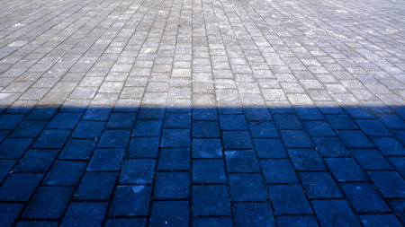 Grey Brick Perspective View For Home Yard With Half Dark And Light Reflectionの写真素材