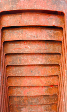 Close-up View Of The Front Of A Tightly Packed Orange Plastic Chair, Photo Taken In Portrait Modeの写真素材
