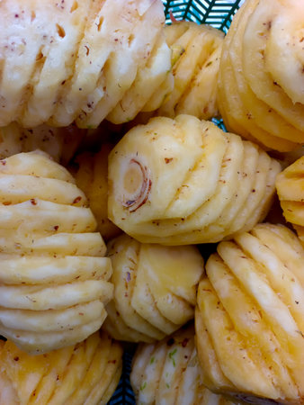 A Pile Of Pineapples That Have Been Peeled And Stacked In A Basketの写真素材
