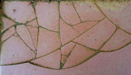 Cracks On The Surface Of A Worn Ceramic Floor
