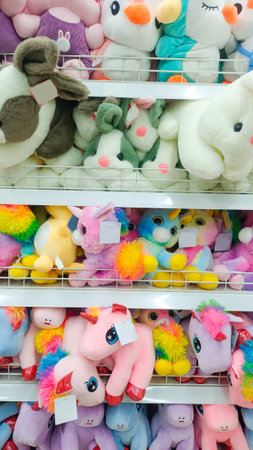 An Arrangement Of Various Dolls With Beautiful Colors And Arranged Neatly On A Shelfの写真素材