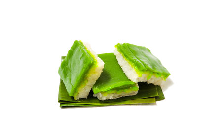 Two Slices of (Kue Ketan Lapis) on Banana Leaf, Isolated on White Backgroundの写真素材