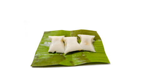 Indonesian Traditional Bugis Cake on Banana Leaf with White Backgroundの写真素材