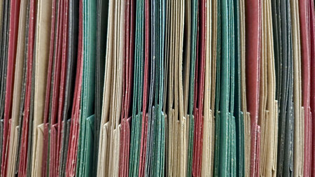 Abstract Vertical Lines of Colorful Hanging File Foldersの写真素材