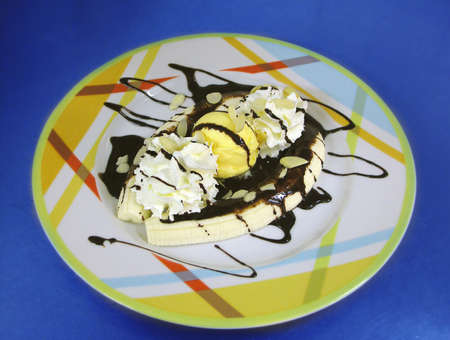 sweet food - banana split on blue backgroundの写真素材