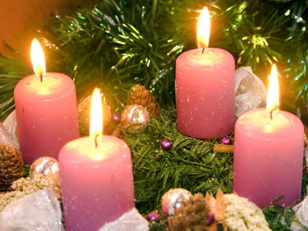 Christmas wreath with violet candlesの写真素材