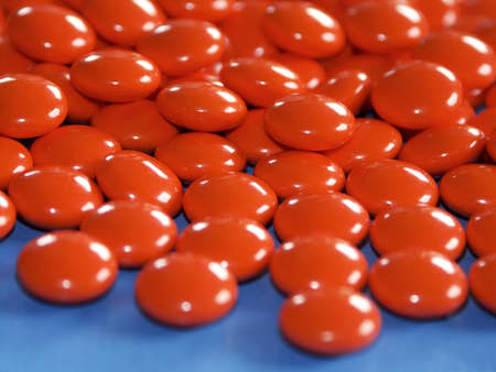 red pills on blue backgroundの写真素材