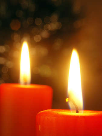 Christmas - two candles with abstract backgroundの写真素材