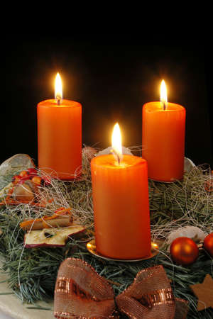 Christmas - wreath from fresh twigs and cones with four candleの写真素材