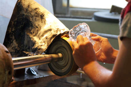 hand work - glass-cutting in factoryの写真素材