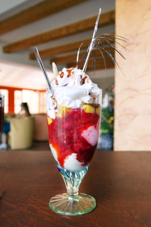 sundae full of fresh fruit and ice cream in sweetshopの写真素材