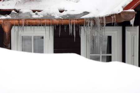 old wood windows with iciclesの写真素材