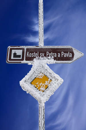 Czech road sign in winter with blue skyの写真素材