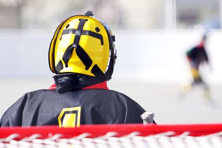 fielding a young hockey goalie in goalの写真素材