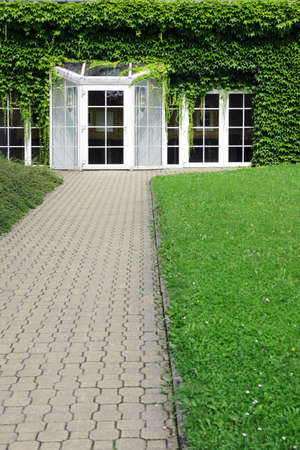 modern building with glass door and ivyの写真素材