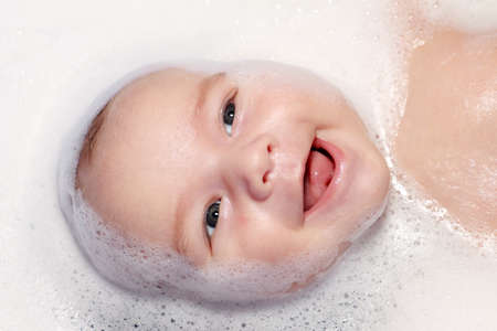 bath and newborn with foamの写真素材