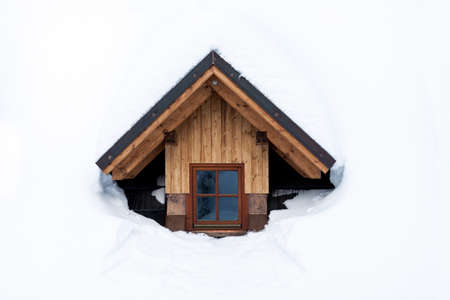 one wooden window in winter with snowの写真素材