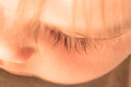 Close-up of eye of a sleeping childの写真素材
