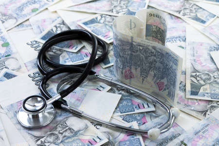 Czech paper money with stethoscope on white backgroundの写真素材