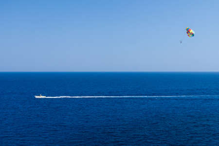 Parasailing is a popular pastime in many resorts around the world. The active form of relaxation.の写真素材
