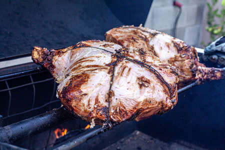 A big piece of pork meat on a grillの写真素材