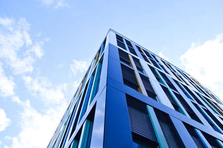 Large blue building with the sky aboveの写真素材