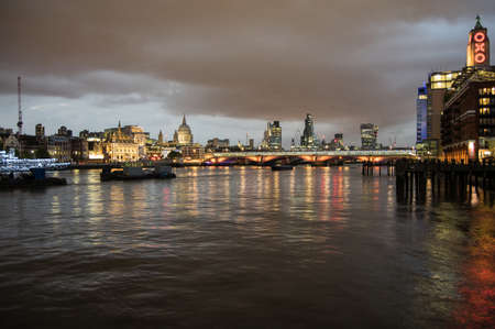 Skyline of London at night. View from south bank with lights reflecting in the thamesのeditorial素材