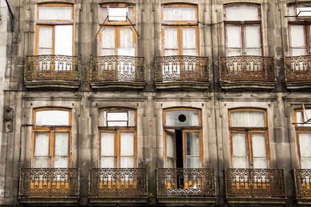 PORTO, PORTUGAL - JUNE 5, 2017: An old balcony with metal gridのeditorial素材