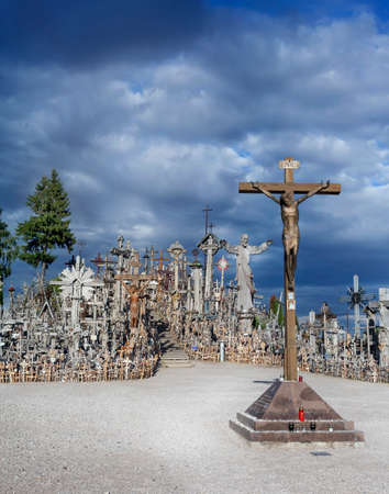 cross with golden Christ to the Hill of Crossesの写真素材