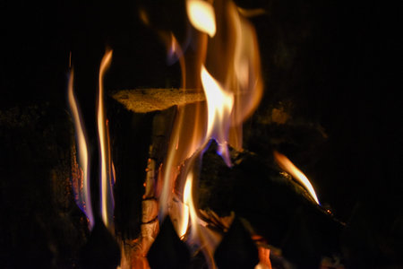 A close up view of a wood and turf hearth fire at Christmas during a cold winters night. 