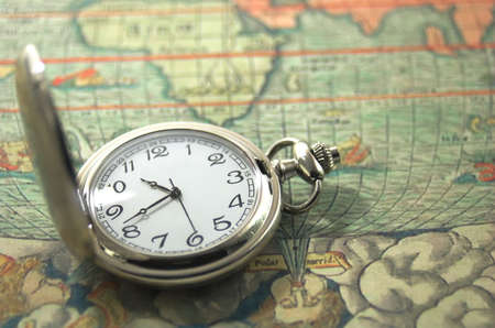 old pocket watch on a mapの写真素材