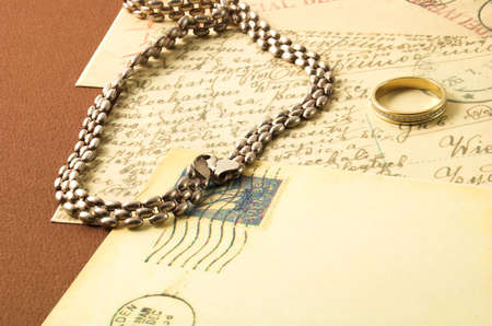 romance vintage postcard and golden ringの写真素材