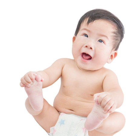 happy baby boy against white backgroundの写真素材