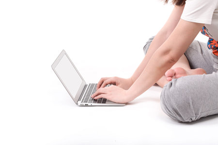 Hands on the laptop computer isolated on white 
