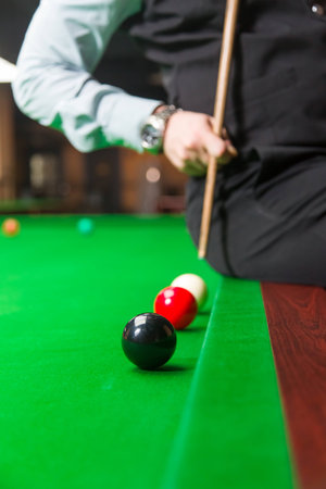 Playing billiard - Close-up shot of a man playing billiard