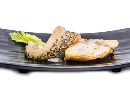 Fried fish dish isolated on white background