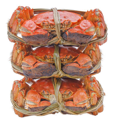 Hairy crabs on the Bamboo steamer Isolated on white backgroundの写真素材