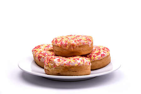 Plate of White Iced Donutsの写真素材