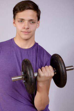 Teenage Boy Doing Strength Trainingの写真素材