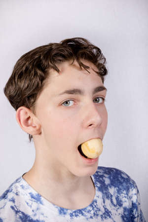 Teenage Boy Eatingの写真素材