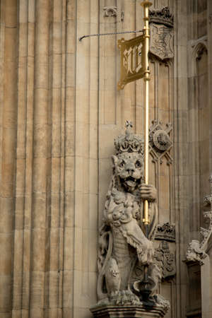 London, United Kingdom - June 5th, 2016: Statue of a lion on the Palace of Westminster at the Sovereign's entrance, under the Victoria Tower.のeditorial素材