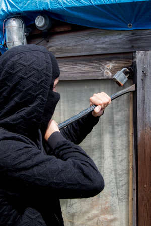 Burglar breaking and enteringの写真素材