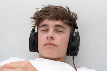 Teenage boy listening to music