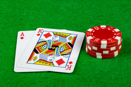 Blackjack hand 21 with betting chipsの写真素材