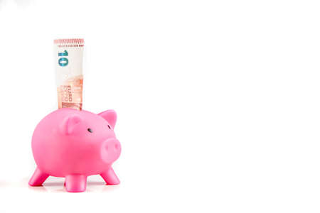 Piggybank with ten Euro banknoteの写真素材