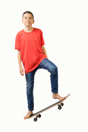 Young teenage caucasian boy with his skateboardの写真素材