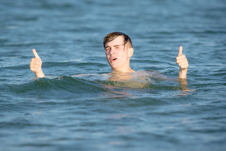 Teenage boy in the sea on a summer's day