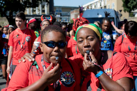 London, United Kingdom - August 27, 2017. Notting Hill Carnival one of the largest street parties in Europe is now in its 51st year. This year was close to the ruin of Grenfell Tower scene of a devastaing fire.のeditorial素材