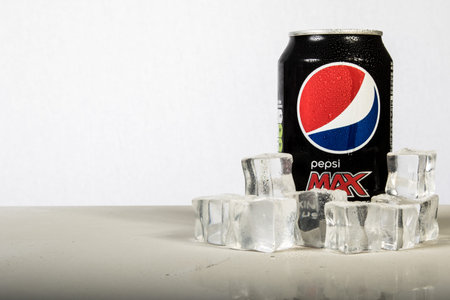 London, 24th October 2017:- A can of chilled Pepsi Max with ice against a white background
