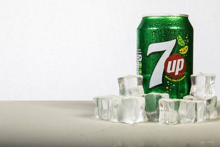 London, 24th October 2017:- A can of chilled 7up with ice against a white background